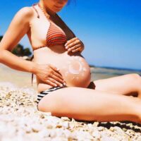 Zwanger in de zon